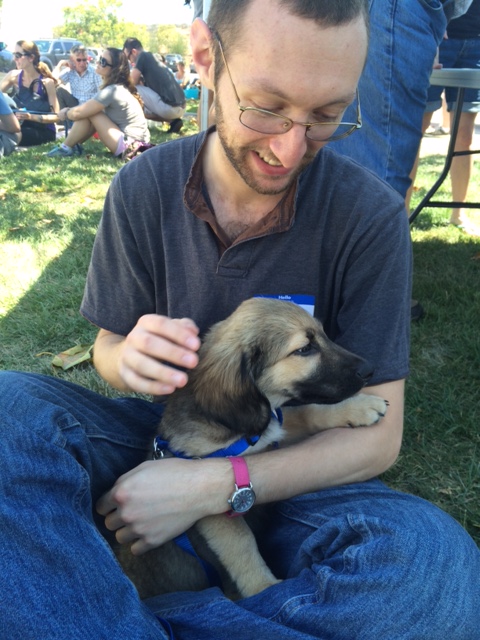 I am holding a puppy! Photo credit: Nadeen Kharputly